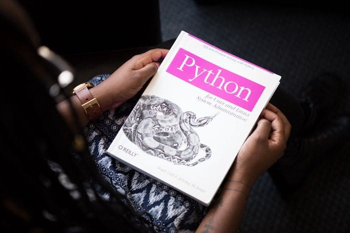 A female is going to start their journey with Python